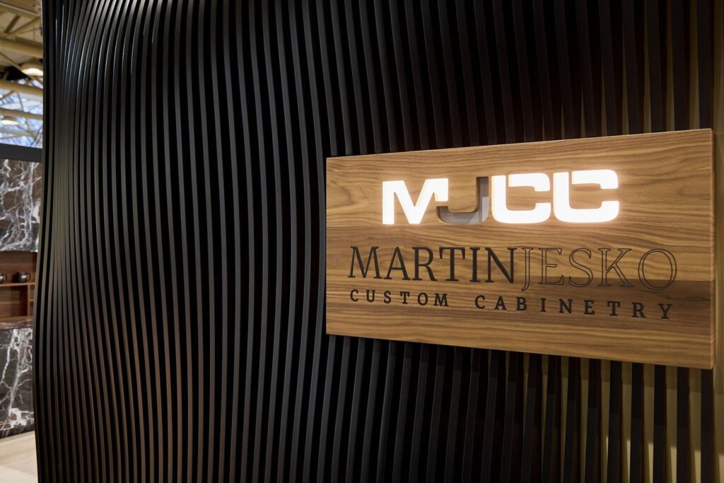 MJCC booth signage and custom cabinetry display at IDS Toronto 2026