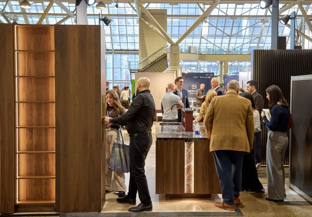 Designers and visitors engaging with MJCC custom cabinetry booth at IDS Toronto 2026 in Toronto